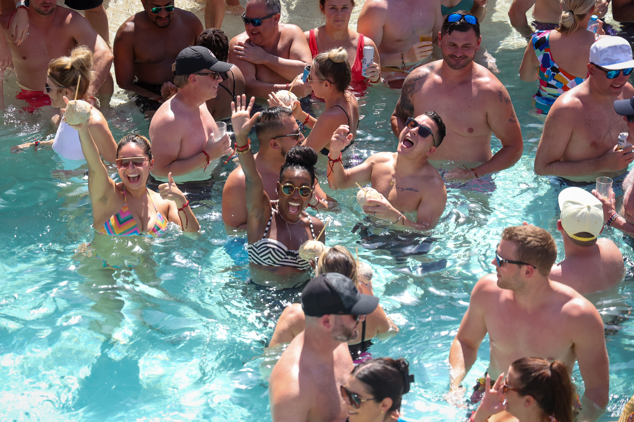 people celebrating in pool